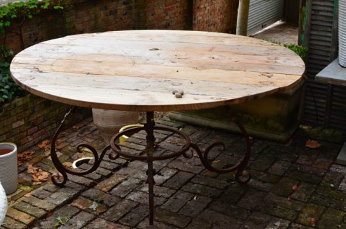 ROUND TEAK TOP METAL SCROLL-BASED TABLE