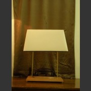 A VINTAGE HOLE PUNCH LAMP WITH CREAM LINEN SHADE